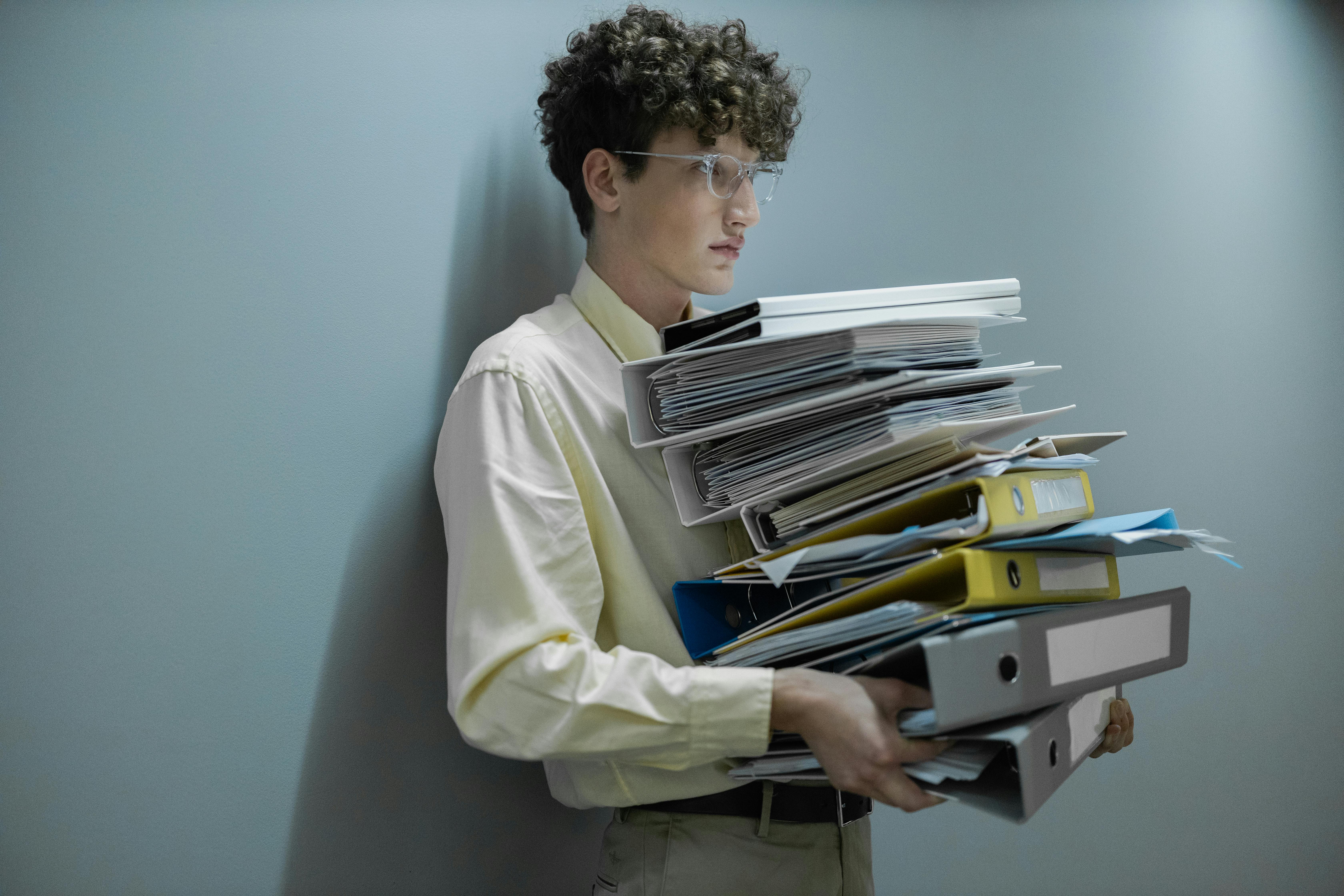 person with a lot of paperwork