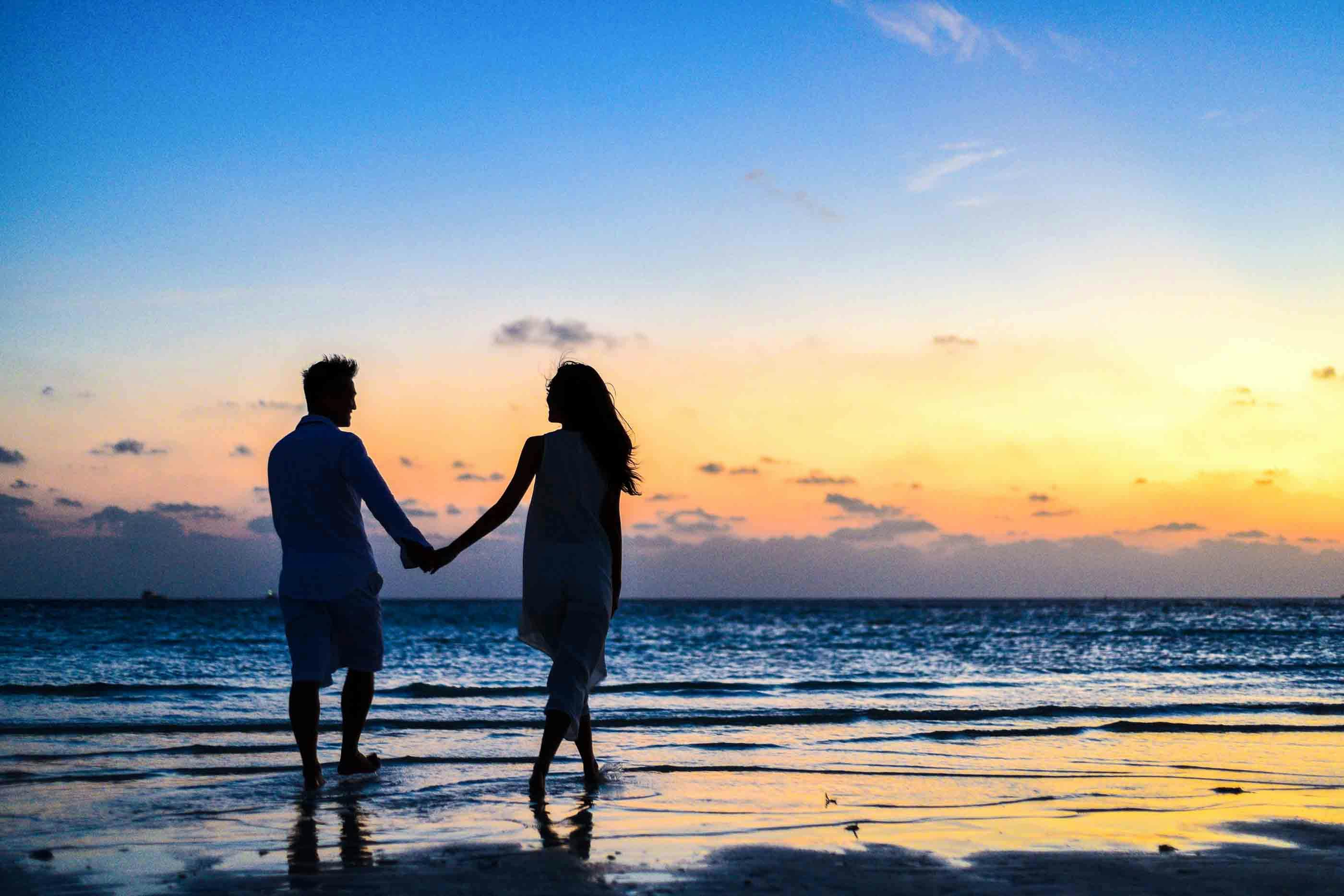 couple at the beach holding hands